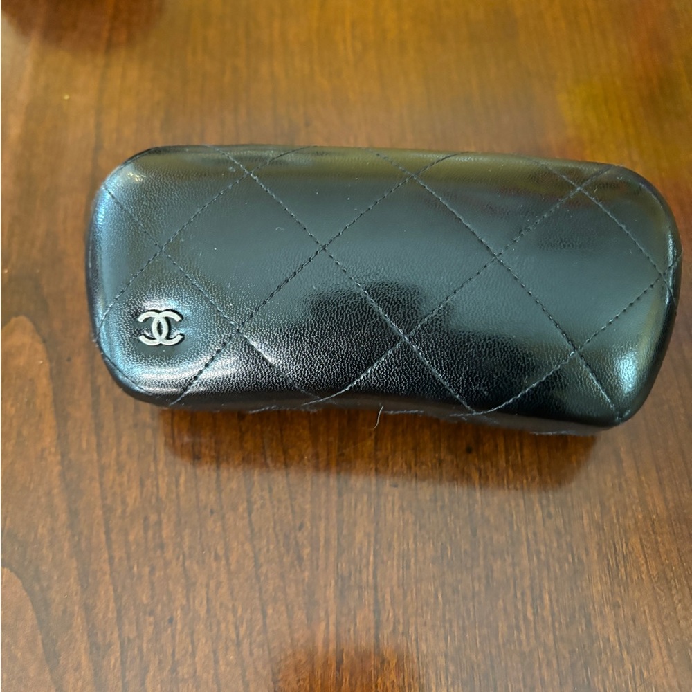 Chanel quilted case with original dust cloth.
